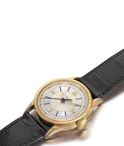 PATEK PHILIPPE. A FINE AND RARE 18K GOLD WRISTWATCH WITH INDIRECT CENTRE SECONDS AND TWO-TONE DIAL
