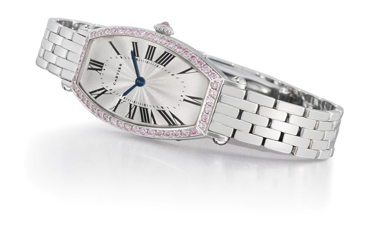 CARTIER. A LADY'S FINE AND RARE 18K WHITE GOLD AND PINK DIAMOND-SET TONNEAU-SHAPED WRISTWATCH WITH BRACELET