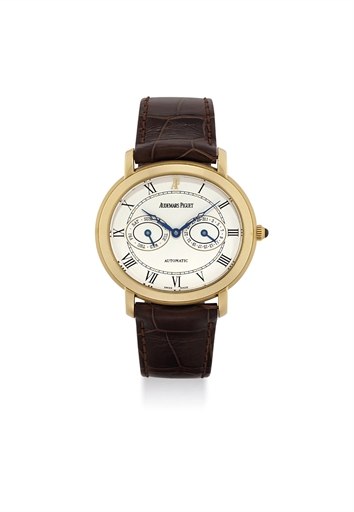 AUDEMARS PIGUET. AN 18K GOLD AUTOMATIC OVAL WRISTWATCH WITH DAY AND DATE INDICATION
