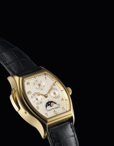 GIRARD-PERREGAUX. A FINE AND RARE 18K GOLD TONNEAU-SHAPED MINUTE REPEATING PERPETUAL CALENDAR WRISTWATCH WITH MOON PHASE AND LEAP YEAR INDICATION