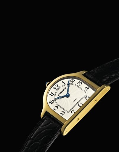 CARTIER. A LIMITED EDITION 18K GOLD BELL-SHAPED WRISTWATCH