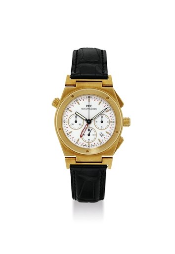 IWC. AN 18K GOLD TONNEAU-SHAPED CHRONOGRAPH WRISTWATCH WITH ALARM AND DATE
