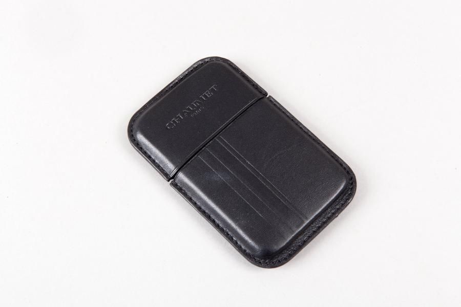CHAUMET;Porte cartes en cuir noir. Excellent…