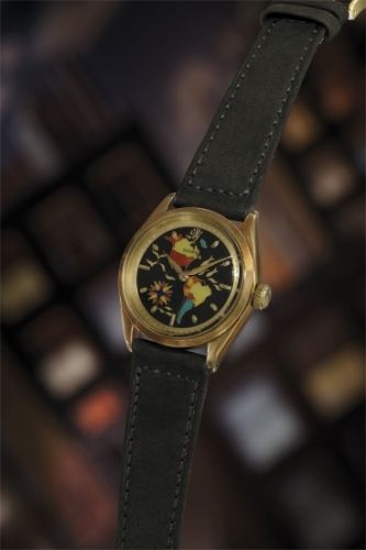 Rolex Follow;Ref. 6284;An exquisite, incredibly fine and highly attractive 14K yellow gold wristwatch with cloisonné enamel dial depicting North and South America.