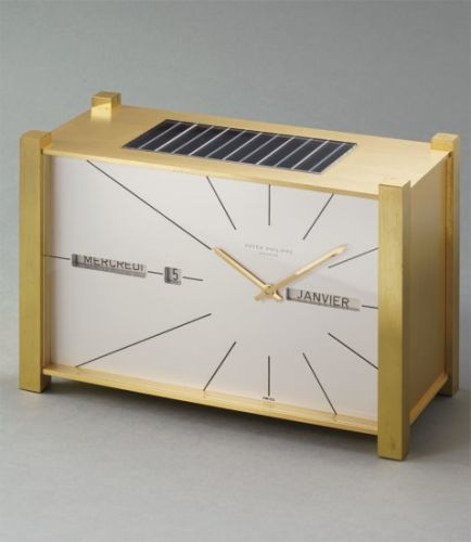 Patek Philippe Follow;Ref. 503;A fine and very rare solar-powered gilt brass table clock with perpetual calendar