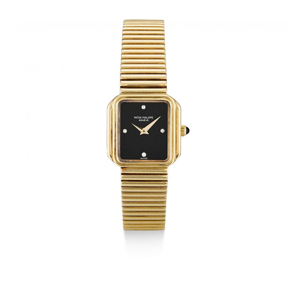 PATEK PHILIPPE | REFERENCE 4429/1, A YELLOW GOLD AND DIAMOND-SET BRACELET WATCH WITH ONYX DIAL, MADE IN 1980