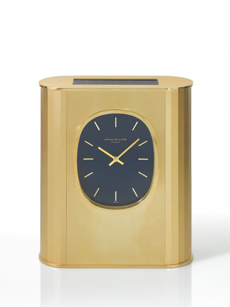PATEK PHILIPPE | REF 31477 ELLIPSE D'OR SOLAR, A GILT BRASS SOLAR-POWERED DESK TIMEPIECE MADE IN 1976