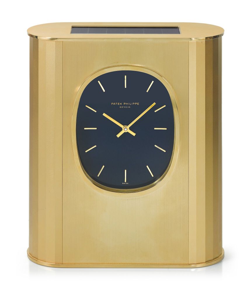 PATEK PHILIPPE | REFERENCE 31477 ELLIPSE D'OR SOLAR A GILT BRASS SOLAR-POWERED DESK TIMEPIECE, MADE IN 1976