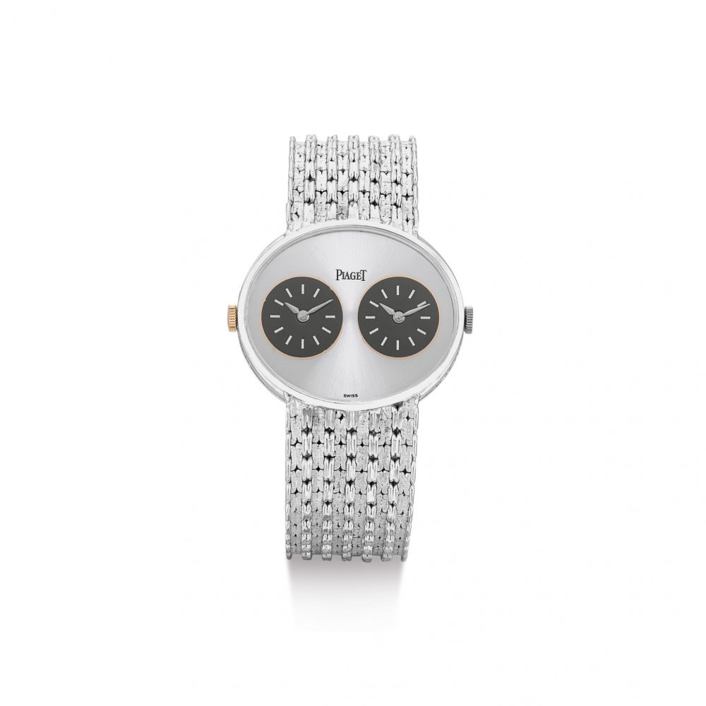 PIAGET | REFERENCE 612501 N35, A WHITE GOLD DUAL TIME ZONE BRACELET WATCH, CIRCA 1975