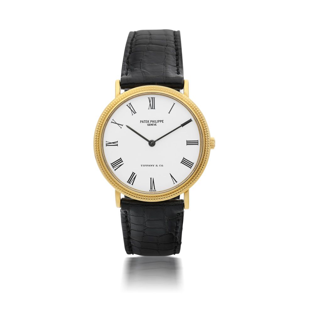PATEK PHILIPPE | REFERENCE 3954J RETAILED BY TIFFANY & CO.: A YELLOW GOLD WRISTWATCH, CIRCA 1988