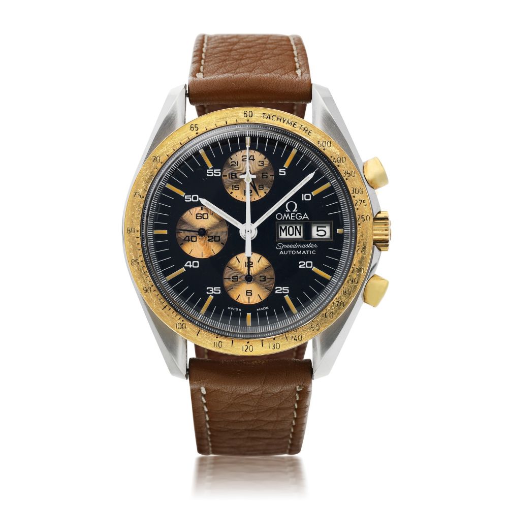 OMEGA | REFERENCE 376.0822 SPEEDMASTER AUTOMATIC 'HOLY GRAIL' A STAINLESS STEEL AND YELLOW GOLD AUTOMATIC CHRONOGRAPH WRISTWATCH WITH DAY AND DATE MADE FOR THE ITALIAN MARKET, CIRCA 1988