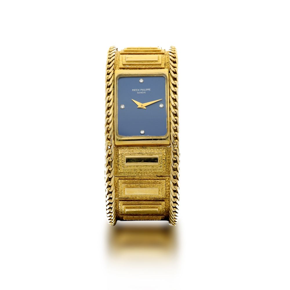 PATEK PHILIPPE | REFERENCE 4241 A YELLOW GOLD RECTANGULAR BRACELET WATCH WITH DIAMOND-SET INDEXES, MADE IN 1984