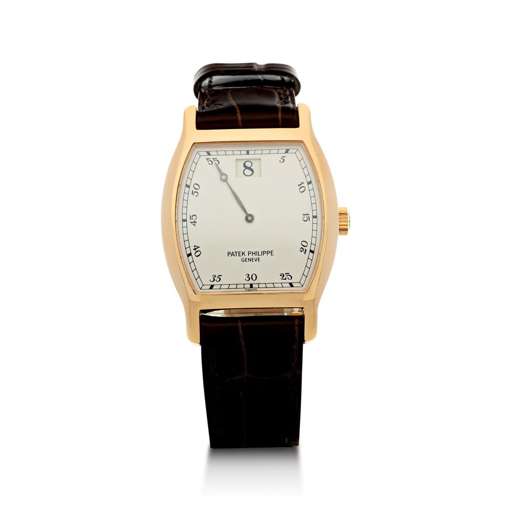PATEK PHILIPPE | REFERENCE 3969 A LIMITED EDITION TONNEAU SHAPED PINK GOLD JUMP HOUR WRISTWATCH, MADE TO COMMEMORATE THE 150TH ANNIVERSARY OF PATEK PHILIPPE, MADE IN 1989