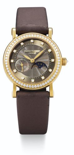 Patek Philippe.A LADY'S YELLOW GOLD AND DIAMOND-SET WRISTWATCH WITH MOON-PHASES REF 4858J MVT 3116110 CASE 4246631 CIRCA 2004