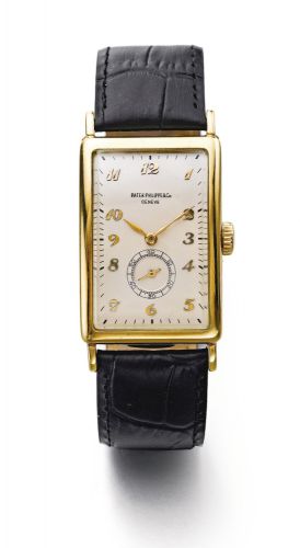 Patek Philippe.A YELLOW GOLD CURVED RECTANGULAR WRISTWATCH REF 431 MVT 950583 CASE 644262 MADE IN 1946
