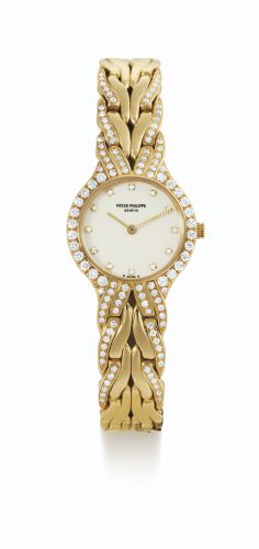 Patek Philippe.A LADY'S YELLOW GOLD AND DIAMOND-SET BRACELET WATCH REF 4816/3 MVT 1609518 CASE 2874163 LA FLAMME CIRCA 1984