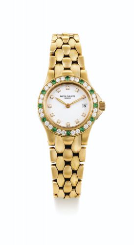 Patek Philippe.A RARE LADY'S YELLOW GOLD, EMERALD AND DIAMOND-SET BRACELET WATCH WITH DATE REF 4881/73J MVT 1537171 CASE 4011519 CIRCA 2000