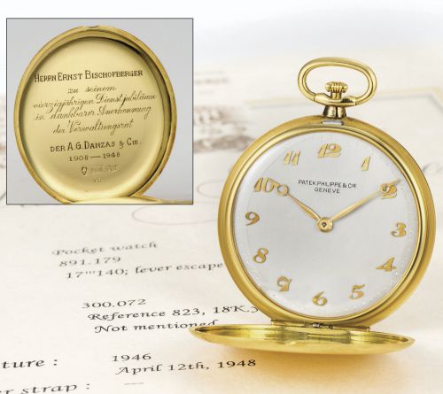 Patek Philippe.A YELLOW GOLD HUNGTING CASED KEYLESS LEVER WATCH REF 823 MVT 891179 CASE 300072 MADE IN 1946