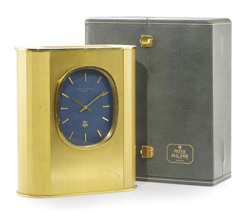 Patek Philippe.A RARE GILT-BRASS SOLAR-POWERED DESK TIMEPIECE MADE FOR THE SOCIETE DE BANQUE SUISSE REF 1505 NO 1802848 MADE IN 1982