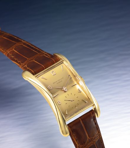 Patek Philippe.A FINE AND RARE PINK GOLD FLARED RECTANGULAR WRISTWATCH REF 2442 MVT 977141 CASE 666855 BANANA MADE IN 1957