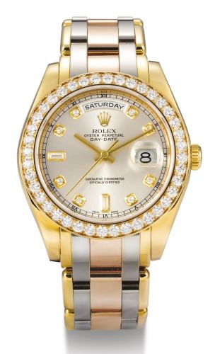 Rolex.A FINE TRI-COLOURED GOLD AND DIAMOND-SET AUTOMATIC CENTER SECONDS WRISTWATCH WITH DAY, DATE, DIAMOND-SET INDEXES AND BRACELET REF 18948 CASE K585477 DAY-DATE CIRCA 2001.A FINE TRI-COLOURED GOLD AND DIAMOND-SET AUTOMATIC CENTER SECONDS WRISTWATCH WIT