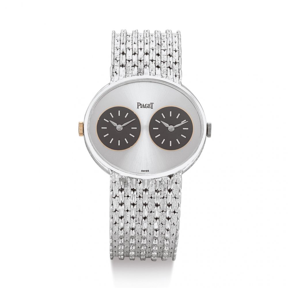 PIAGET | REFERENCE 612501 N35 A WHITE GOLD DUAL TIME ZONE BRACELET WATCH, CIRCA 1975 | 伯爵 | 型號612501 N35 白金兩地時間鏈帶腕錶，錶殼編號187765，約1975年製