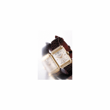 PATEK PHILIPPE, CIRCA 1945, NO.839.561, REF.1592, AN UNUSUAL GOLD RECTANGULAR WRISTWATCH WITH HOODED LUGS