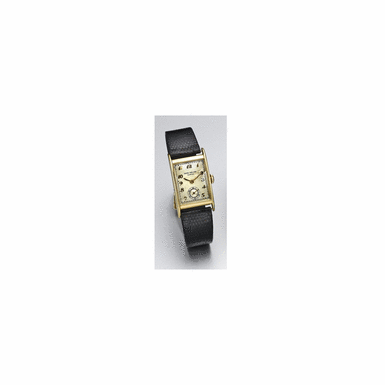 PATEK PHILIPPE - Movement No. 971779, Case No. 656290, Ref. 1560/1, Circa 1949, A Gold Curved Rectangular Wristwatch