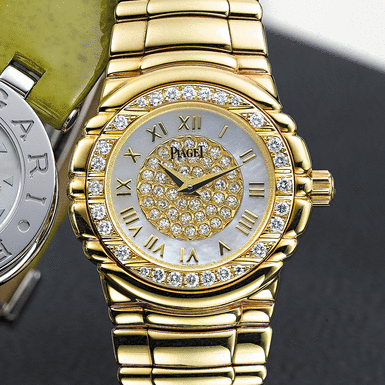 PIAGET, A LADY'S GOLD AND DIAMOND SET BRACELET WATCH WITH MOTHER-OF-PEARL DIAL TANAGRA, CIRCA 2003