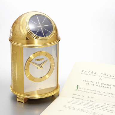 PATEK PHILIPPE - A FINE AND RARE GILT BRASS SOLAR-POWERED TIMEPIECE 'Arabesques', 1971, no.874.592, ref.707.07