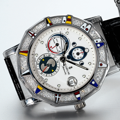 CORUM, A WHITE GOLD AND DIAMOND SET AUTOMATIC CENTRE SECONDS DODECAHEDRAL WRISTWATCH WITH TIDE INDICATION, MOON-PHASES AND DATE CIRCA 2003 ADMIRAL'S CUP MAREES