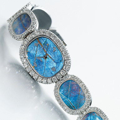 PATEK PHILIPPE, RETAILED BY ASPREY: A LADY'S ELLIPTICAL WHITE GOLD AND DIAMOND BRACELET WATCH WITH TURQUOISE AND BUTTERFLY WING DIAL CIRCA 1973 'BUTTERFLY WINGS' REF 4117-1G MVT 1248219 CASE 2715278