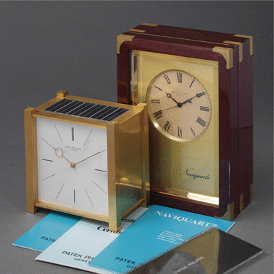 PATEK PHILIPPE - Two Gilt Metal Desk Timepieces CIRCA 1976 REF 1208 NAVIQUARTZ CASE 1803134, and, CIRCA 1964 REF 471 PENDULE CARR