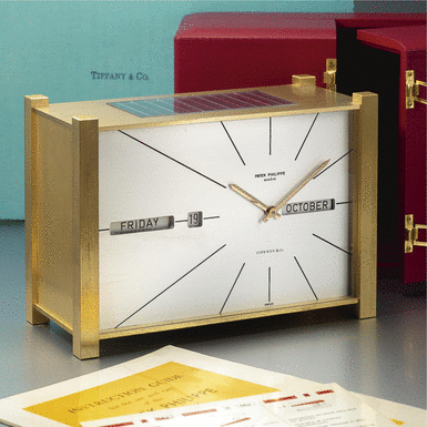 PATEK PHILIPPE - Retailed by Tiffany & Co.: A Fine and Rare Gilt-Brass Solar Powered Perpetual Calendar Desk Timepiece with Digital Display CIRCA 1966 REF 503EQ MVT 874021 CASE 1559
