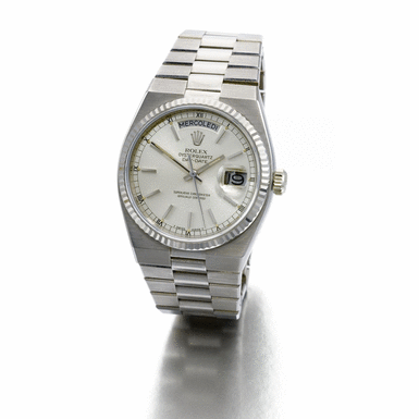 ROLEX - a white gold tonneau-form wristwatch with day, date and bracelet Circa 1980 ref 19019 oyster quartz day-date