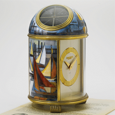 Property of the Original Owner - PATEK PHILIPPE - RETAILED BY CARTIER: A FINE AND UNIQUE GILT-BRASS SOLAR-POWERED DESK TIMEPIECE WITH CLOISONN