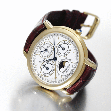 AUDEMARS PIGUET - A YELLOW GOLD OVAL AUTOMATIC PERPETUAL CALENDAR WRISTWATCH WITH MOON-PHASES CIRCA 2000 MILLENARY NO 15