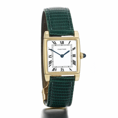 CARTIER - A RECTANGULAR YELLOW GOLD REVERSIBLE WRISTWATCH CIRCA 1975