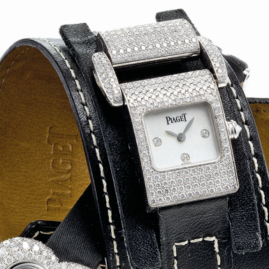 PIAGET - A LADY'S WHITE GOLD AND DIAMOND SET WRISTWATCH WITH MOTHER-OF-PEARL DIAL CIRCA 2000 MISS PROTOCOLE