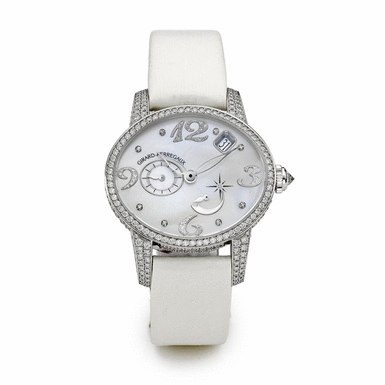 GIRARD-PERREGAUX - A WHITE GOLD AND DIAMOND-SET OVAL AUTOMATIC WRISTWATCH WITH DATE AND POWER RESERVE CIRCA 2008 REF 80482 CAT'S EYE