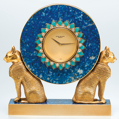 PATEK PHILIPPE - A FINE AND RARE YELLOW GOLD, LAPIS LAZULI, TURQUOISE AND DIAMOND-SET MINIATURE EGYPTIAN-STYLE TABLE CLOCK CIRCA 1978 REF 2011 MVT 1500401 CASE 2780492