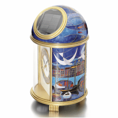 PATEK PHILIPPE - A RARE AND UNIQUE GILT-BRASS SOLAR-POWERED DESK TIMEPIECE WITH CLOISONN