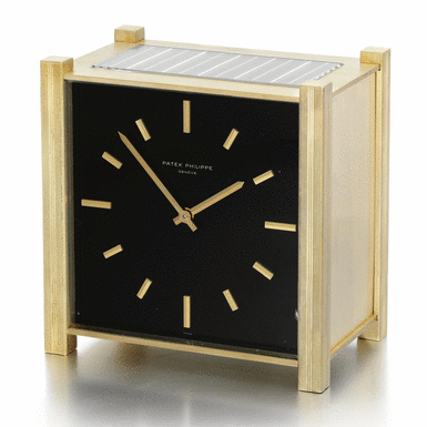 PATEK PHILIPPE - A GILT METAL SOLAR-POWERED DESK TIMEPIECE 1966 REF 928 MVT 873896 CASE 1536