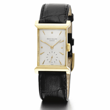 PATEK PHILIPPE - A FINE 18K YELLOW GOLD RECTANGULAR WRISTWATCH 1951 REF 2404J MVT 973762 CASE 666777