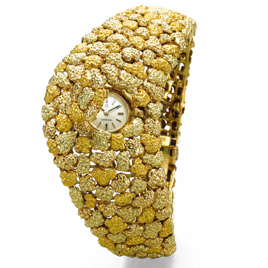 OMEGA - A LADY'S TWO COLORED GOLD BACK-WOUND BRACELET WATCH CIRCA 1975