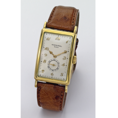 PATEK PHILIPPE - AN 18K YELLOW GOLD LARGE RECTANGULAR HINGED CURVED WRISTWATCH 1946 REF 431 MVT 950665 CASE 644278