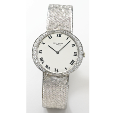 PATEK PHILIPPE - A PLATINUM AND DIAMOND-SET OVAL BRACELET WATCH 1965 REF 3486 MVT 1132433 CASE 2632778