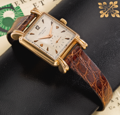 PATEK PHILIPPE - A RARE AND OVERSIZED 18K PINK GOLD RECTANGULAR WRISTWATCH WITH FLUTED TEARDROP LUGS CIRCA 1950 REF 2440 MVT 954034 CASE 657101