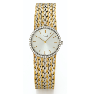 PIAGET - A LADY'S TWO COLORED GOLD AND DIAMOND-SET BRACELET WATCH CIRCA 1970