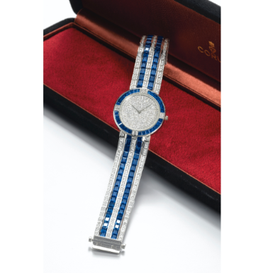 CORUM - A FINE PLATINUM, SAPPHIRE AND DIAMOND-SET BRACELET WATCH CIRCA 1995